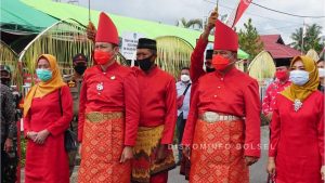 Bupati Iskandar Kamaru  dan Wabup Deddy Abdul Hamid Dijemput Adat Mongondow
